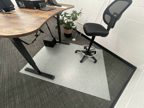 ESD chair mat for use over carpet or hard surface flooring